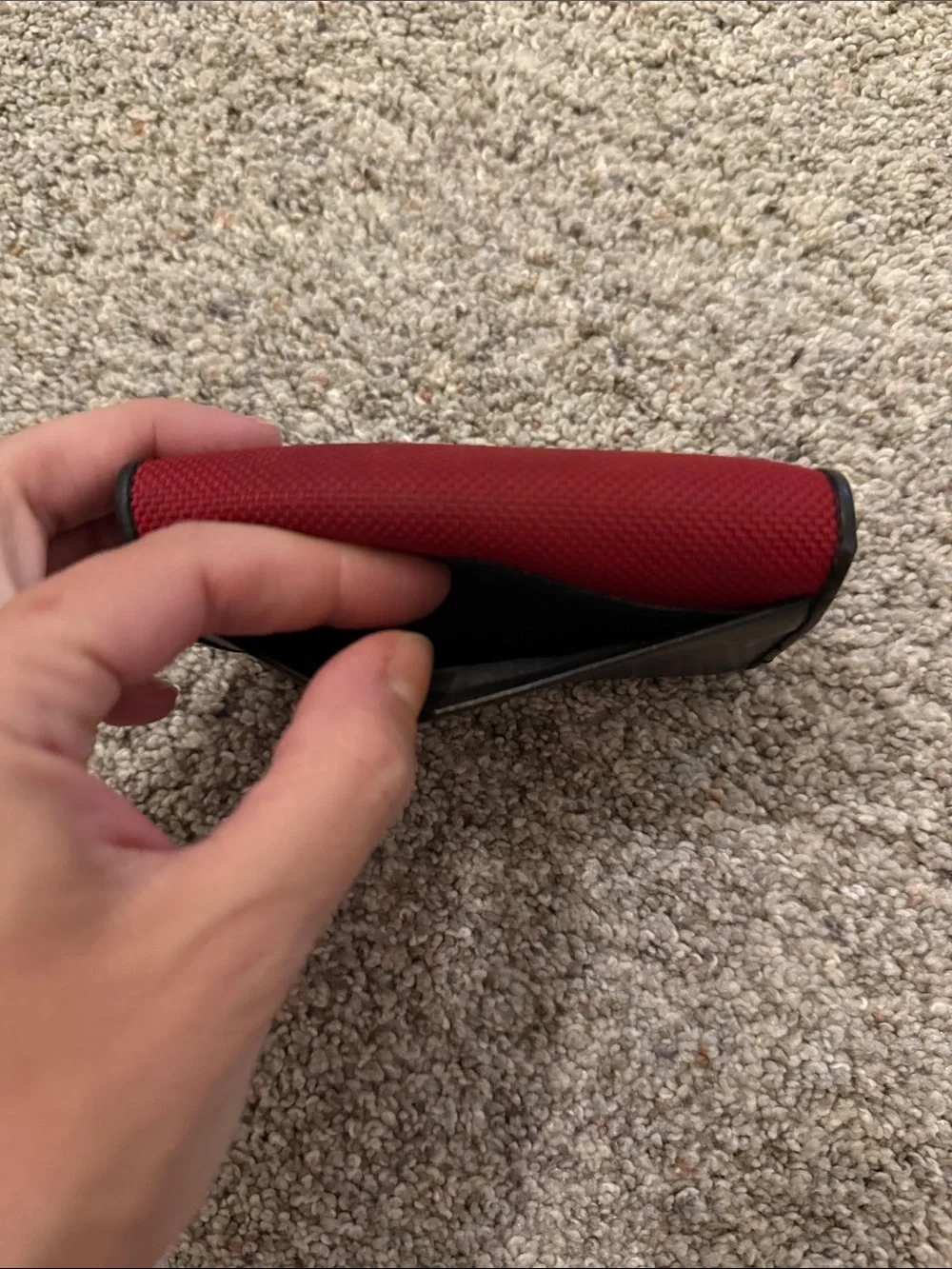 Tumi Black Leather Trifold Wallet with Red Fabric Trim